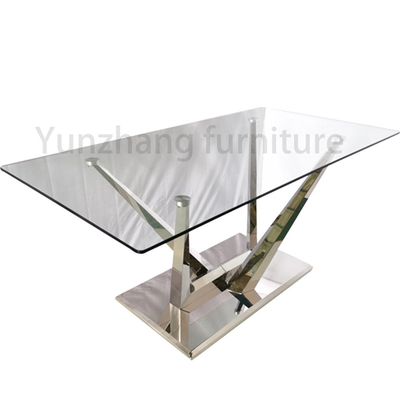 Mesa de jantar prateada com vidro transparente