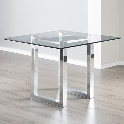 Mesa de jantar prateada com vidro transparente
